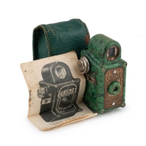 CORONET: Midget subminiature Bakelite camera, c. 1935, in light green with maker's leather case and instruction sheet.