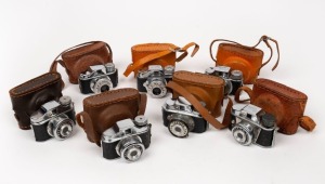 TOUGODO: Seven c. 1950s Hit-type subminiature cameras, all in leather cases - one Crown, one Crystar, one Hit, one Kitty, one Teemee, one Toyoca, and one Traveler. (7 cameras)