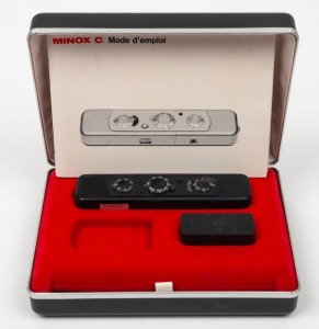 MINOX: Minox C subminiature camera [#2462700], c. 1970s, in black with Minox 15mm f3.5 lens. Offered in maker's case with black leatherette camera case, chain, film canister, and two instruction booklets.