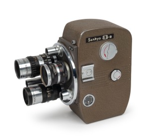 SANKYO: Sankyo 8-R movie camera [#32664], c. 1950s, with six lenses on turret and shutter release cable attachment.