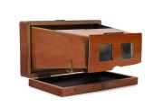 Folding handheld polished mahogany stereoscope, c. 1910s, of French manufacture with 'N H Brevette&nbsp;S.G.D.G.' imprint on top element.
