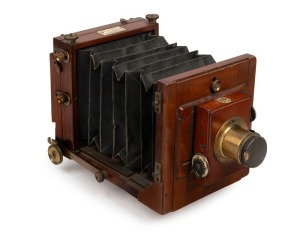 UNDERWOOD: 3⅛ x 4⅛" plate tailboard camera, c. 1880s, with Underwood lens with f11/16/22/32 aperture markings, Thornton-Pickard roller-blind shutter, lens cap, and 'John Piggott Cheapside London' retailer's plate.