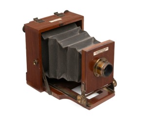 LANCASTER: 'Merveilleux' 10.5 x 10.5cm field camera, c. 1880s, with integrated lens and tripod attachment.