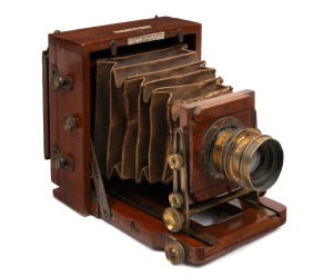 LANCASTER: '1894 Instantograph' 4¼ x 3¼" plate field camera, with Taylor, Taylor & Hobson 6½ x 4¾" R. R. lens [#12122], and unusual rear hinge mechanism.