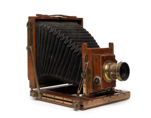 TYLER & ENGLAND: 'KC No. 3' 4¾ x 6½" plate field camera, c. 1900, with lens with f8/11/16/22/32/44/64 aperture markings and Thornton-Pickard roller-blind shutter.