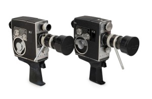 BOLEX-PAILLARD: Two c. 1964 8mm movie cameras - one K1 Zoom Reflex Automatic with orange lens filter and lens cap, together with one K2 Zoom Reflex Automatic with lens cap. (2 movie cameras)