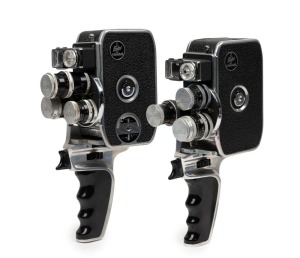 BOLEX-PAILLARD: Two c. 1958 double-8 movie cameras, both with pistol-grip attachment and all metal lens caps present - one D8L [#817230] and one D8LA [#876511]. (2 movie cameras)