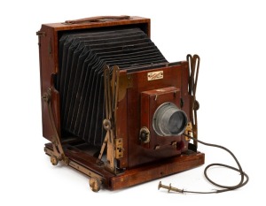 HOUGHTON: 'Sanderson Junior' 4¾ x 6 ½" plate triple-extension field camera, c. 1903, with Beck Isosticmar 6.25" f5.8 lens [#114636], Thornton-Pickard roller-blind shutter, and Watson Bowden 'The Antinuous' shutter release cable.