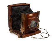 HOUGHTON: 'Sanderson Junior' 4&frac34; x 6 &frac12;" plate triple-extension field camera, c. 1903, with Beck Isosticmar 6.25" f5.8 lens [#114636],&nbsp;Thornton-Pickard roller-blind shutter,&nbsp;and Watson Bowden 'The Antinuous' shutter release cable.