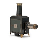 ERNST PLANK: Children's magic lantern, height 23.5cm, in maker's box with nine glass slides, c. 1890s. - 2