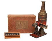 MAX DANNHORN: Children's magic lantern, height 35cm, in maker's box with ten glass slides,&nbsp;c. 1898. - 2