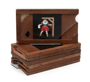 Seven 17.5 x 10cm glass magic lantern 'slipping slides', c. 1850s, featuring bawdy and comedic scenes.