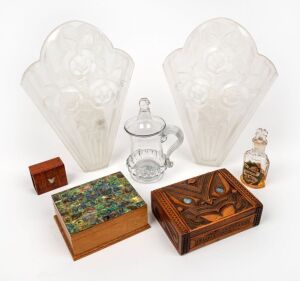 A pair of vintage frosted glass light panels, an antique glass cup and cover, an antique glass French perfume bottle, two vintage New Zealand timber and paua shell boxes, an Australian fiddleback blackwood matchbox hold with silver map of Tasmania and a vintage circular brass clasp in the Archaic style, 20th century, (8 items), the perfume bottle 11cm high