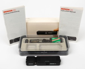 MINOX: Minox EC subminiature camera [#2823963], c. 1981, with 15mm f5.6 lens, together with FE4 flash cube accessory, two instruction manuals, and maker's box.