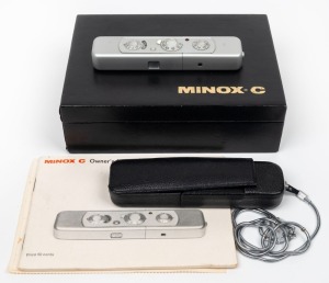 MINOX: Minox C subminiature camera [#2434636], c. 1970s, with Minox 15mm f3.5 lens. Offered in maker's case with black leatherette camera case, chain, and instruction booklet.