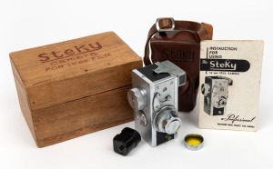 RIKEN: Steky IIIa subminiature camera [#12591], c. early 1950s, with Stekinar 25mm f3.5 lens. Offered in wooden box with leather casing, metal lens cap, yellow lens filter, instruction booklet, and additional film cassette.