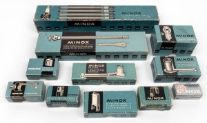 MINOX: Eleven accessories, all of them in maker's boxes - one Pocket Tripod with Leather Purse, one Tripod Adapter, one Model B Flash Gun, one Model B Reflex Viewfinder, one chrome Model B Right Angle Finder, one grey plastic Right Angle Finder, one Binoc