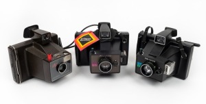 POLAROID: Three c. mid 1970s instant film cameras with carry straps - one Polaroid EE 55, one Polaroid EE 66, and one Polaroid Zip Land Camera. (3 cameras)