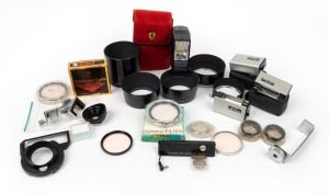 OLYMPUS: Accumulation of twenty-four accessories, several with maker's box or case - seven lens hoods, five lens filters, three Pen-Flash units, one PS-200 flash, two Pen-F accessory shoes, one Pen F eye cup attachment, one Pen-F Attachment Lens, one clos