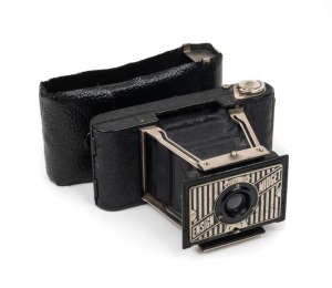 HOUGHTON: Ensign Midget 22 strut-folding camera [#271186], c. 1935, in black with rare leather case.