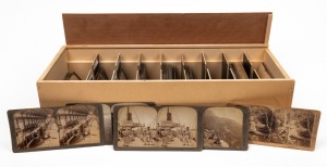 UNDERWOOD & UNDERWOOD: More than eighty stereo cards sorted into 50 x 22.5 x 13.5cm wooden box, featuring subjects such as Ottoman Palestine, Boer War, Russo-Japanese War, shipping scenes including Arctic whaling ships and cutlass drill on deck of HMS Niobe in Cape Town, Prince of Wales on visit to New Zealand, Swiss Alps and alpine villages, and many others. (80+ cards)