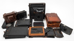 VARIOUS MANUFACTURERS: Twenty-three double-dark slides in five different varieties, together with eight different camera backs, one Kern Paillard lens cap, and one Zeiss Ikon leather camera case. (33 items)