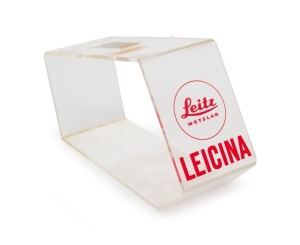 LEITZ: 11.5cm tall clear plastic point-of-sale display stand, with 'Leitz Wetzlar Leicina' text printed in red on front.