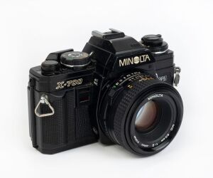 MINOLTA: Black-body X-700 SLR camera, c. 1981, with MD 50mm f2 lens [#1402447].