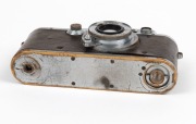 LEITZ: Chrome Model F Leica III [#139050 - corresponding to 1934], with Elmar 50mm f3.5 lens and with brown leather Leica case. Defaced Reichsadler&nbsp;symbol and anomalous 'M 66' engravings&nbsp;present above serial number on top plate likely to be fanciful addit - 5