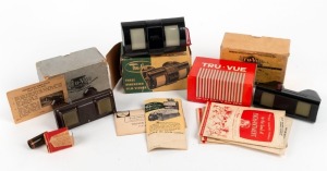 TRU-VUE: Three different c. 1950s Tru-Vue stereoscopes (two in black Bakelite and one in metal), all in maker's boxes, together with four film cards in card sleeves. (7 items)