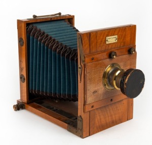 EUGEN LOEBER: 'Reisekamera' 5 x 7" tropical wood tailboard camera, c. 1895, with well-preserved blue bellows, Schlesicky-Ströhlein Frankfurt am Mein Rapid Aplanat Comfort Serie B.A8 lens [#6158], and lens cap.