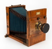 EUGEN LOEBER: 'Reisekamera'&nbsp;5 x 7" tropical wood tailboard&nbsp;camera, c. 1895, with well-preserved blue bellows, Schlesicky-Str&ouml;hlein Frankfurt am Mein Rapid Aplanat Comfort Serie B.A8 lens [#6158], and lens cap.