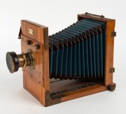 EUGEN LOEBER: 'Reisekamera'&nbsp;5 x 7" tropical wood tailboard&nbsp;camera, c. 1895, with well-preserved blue bellows, Schlesicky-Str&ouml;hlein Frankfurt am Mein Rapid Aplanat Comfort Serie B.A8 lens [#6158], and lens cap. - 2