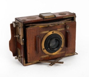 2½ x 3½" strut-folding field camera with Ross London 8½" Compound Homocentric lens [#71318], folding Newton finder, spirit level, and shutter speed conversion table in German.