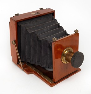 BENETFINK: 'Ajax' 4¾ x 6½" field camera, c. 1900s, with lens with f8/11/16/22/32/44/64 aperture markings and lens cap.