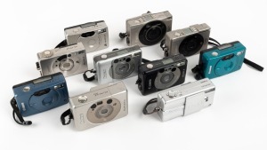 CANON: Ten c. late 1990s compact cameras - one Elph, one Elph 2, one Elph Jr. in silver, one Elph Jr. in black, one Elph 370z, one Elph Z3, one Elph LT260, one Elph LT in turquoise, one Elph LT in silver, and one Elph LT in blue. (10 cameras)