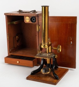 Brass and steel microscope with base engraved 'Made for Barraclough Melbourne & Sydney', 37.5cm at highest setting, in timber box with multiple additional eyepieces and lower tray filled with various prepared slides, 19th century.