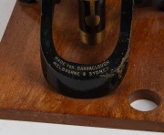 Brass and steel microscope with base engraved 'Made for Barraclough&nbsp;Melbourne & Sydney', 37.5cm at highest setting, in timber box with multiple additional eyepieces and lower tray filled with various prepared slides, 19th century. - 2