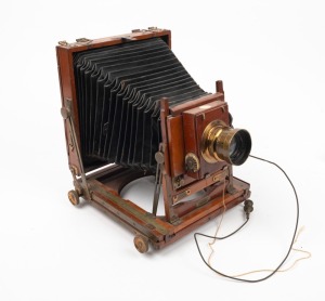 HOUGHTON: No. 1A 'Triple Victo' 4¾ x 6½" triple extension field camera, c. 1900s, with Ensign Aplanat 9 f7.7 lens, Thornton-Pickard roller-blind shutter, and Watson Bowden 'The Antinuous' shutter release cable.