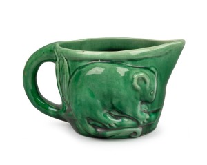 MELROSE WARE green glazed pottery possum jug, bearing remains of original paper label, ​​​​​​​11cm high, 20cm wide