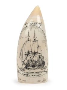 A scrimshaw whale's tooth engraved with tallship titled "LADY SHORE, 1797", 13.5cm long