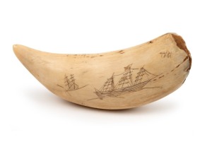 A scrimshaw whale's tooth engraved with two views of a tallship, 15.5cm long