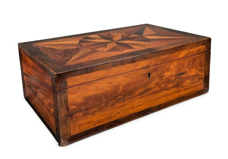 An antique Anglo-Ceylonese writing slope with specimen wood inlay, 19th century. Finely crafted with two separate secret compartments, fitted with drawers, 16cm high, 44cm wide, 26cm deep