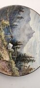 An antique French faience&nbsp;pottery plaque with hand-painted landscape scene, signed on reverse "Dent du Midi" with monogram mark, 36cm diameter - 4
