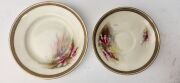 ROYAL WORCESTER pair of antique English teacup, saucer and plate sets hand-painted with Australian wildflowers titled "Christmas Bush" and "Heath", signed "R. Austin", (6 items), puce factory mark to bases and retailed by "Hardy Brothers Ltd,", the saucer - 6