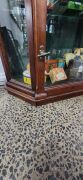 An antique English mahogany display cabinet with unusual drop-in door mechanism, metal shelf racking and chamfered sides, late 19th century, 204cm high, 89cm wide, 28cm deep - 3