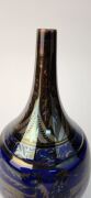 PILKINGTON ROYAL LANCASTRIAN bottle shape rich ruby & blue lustre glazed vase adorned with lions and trailing foliate motif, signed "W. S. Mycock, 1923", 23cm high - 3