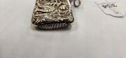 An antique Chinese export silver vesta with repousse dragon decoration, 19th/20th century, 5.5cm high - 3