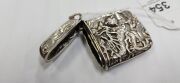 An antique Chinese export silver vesta with repousse dragon decoration, 19th/20th century, 5.5cm high - 4