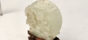 An antique Chinese jade ornament carved with blossom tree, on carved timber stand, Qing Dynasty, 18th/19th century, 8cm high overall - 2